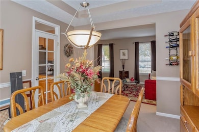 French doors on the left lead into the kitchen.