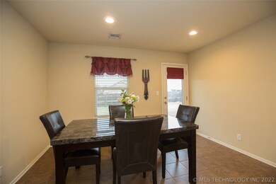 Recessed lighting & access to covered back patio.