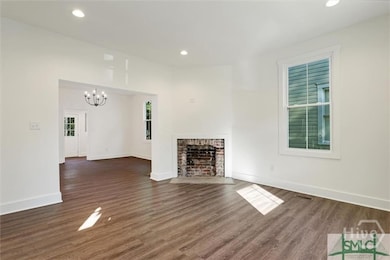 View form front door into living room and back laundry room and rear door and bath access - unpainted or decorated