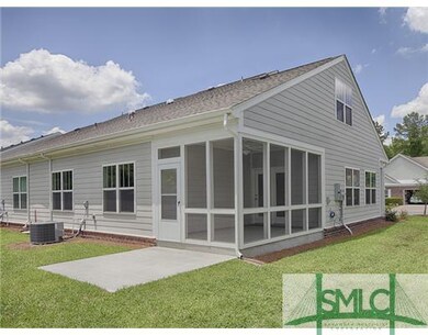 Exterior Back. large screened porch and patio