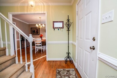 Foyer highlighting crown & chair mouldings, hardwo