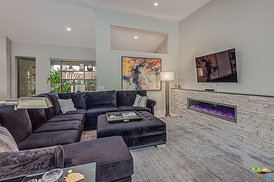 Living room seating area with artistic fire effect