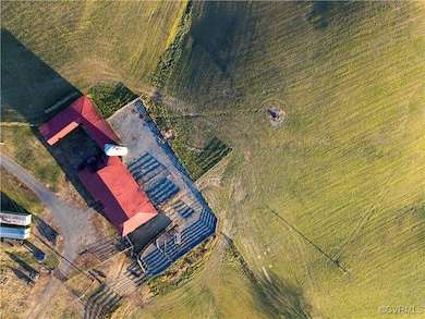 Birds eye view of property featuring a rural view