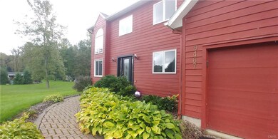 Paver walk way and mature landscaping greet you at