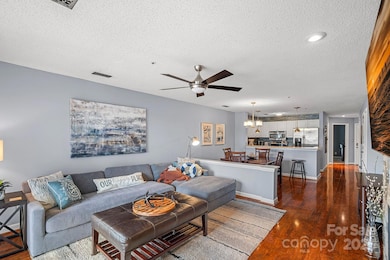 Cozy waterfront retreat with open floor plan, gas fireplace, and covered balcony to take in the views.