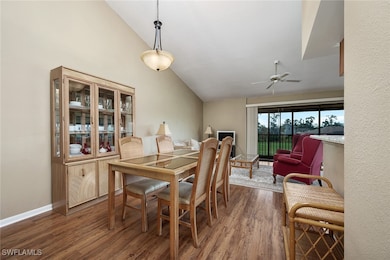 Dining room with lofted ceiling, ceiling fan, and