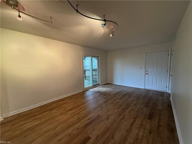 Living room with sliding glass doors to 1 of 2 decks