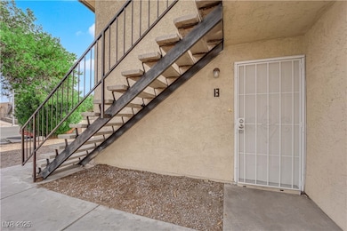 Doorway to property with stucco siding