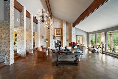 Living room with finished concrete flooring, beam