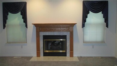 Custom shades enhance the living room windows.