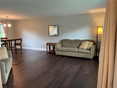You are welcomed by an open living room with bambo