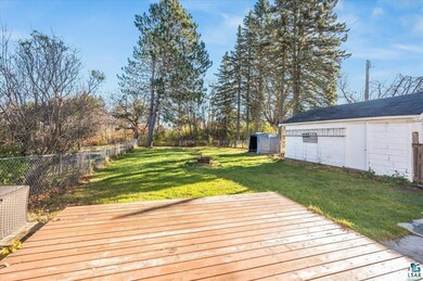 Wooden terrace with a lawn