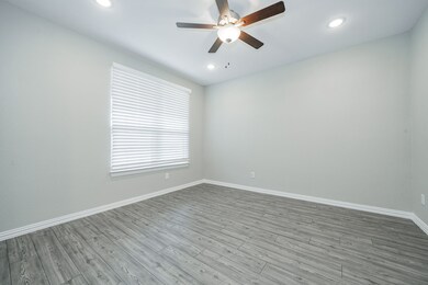 Unfurnished room featuring wood finished floors, recessed lighting, and a ceiling fan