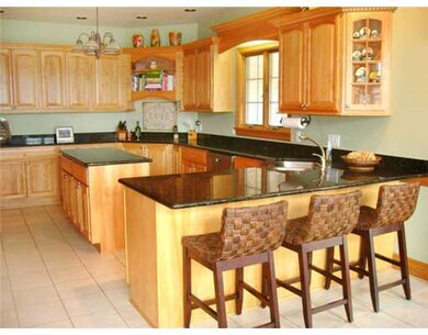 Kitchen. Spacious kitchen with red birch cabinetry