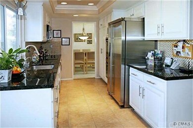 Kitchen Boasts Granite Countertops, Travertine Til