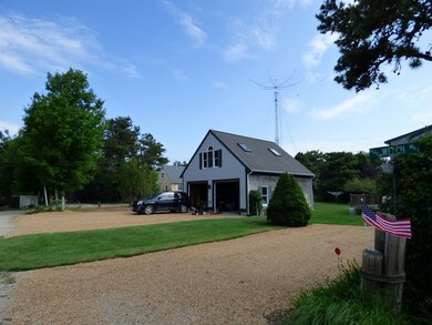 Two-car garage with loft. Two driveways on property.