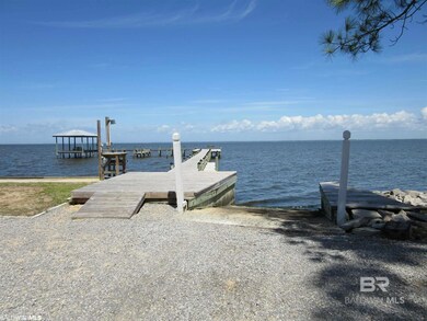 Dock featuring a boat ramp and a water view