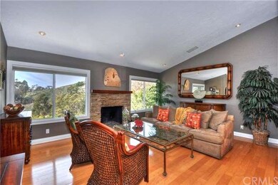 Spacious living room offers grand views of the hil