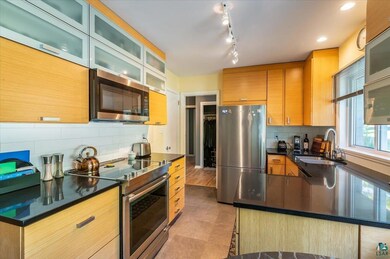 Kitchen with appliances with stainless steel finis