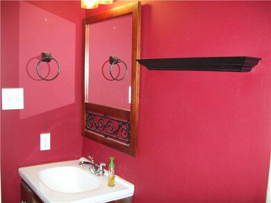 Updated bathroom with decorative mirror and vanity