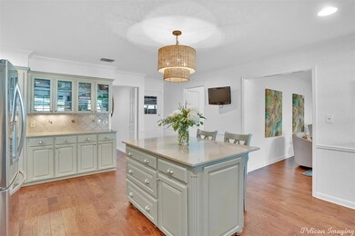 Kitchen with pendant lighting, a center island, st