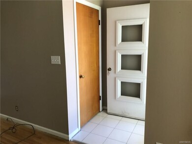 Ceramic tiled entry with ample coat closet.