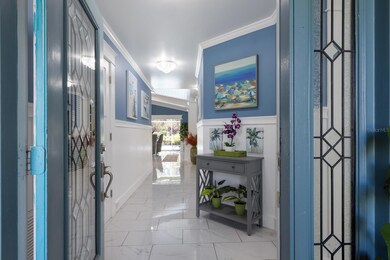 Lovely foyer entry with stained glass front doors