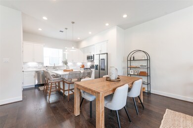 Spacious and modern kitchen-dining area with sleek