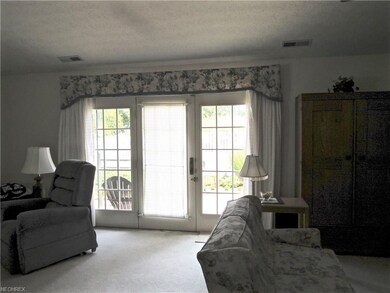 The glass french doors lead to the private patio.
