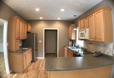 Eat in kitchen, with slider to deck, and hardwood