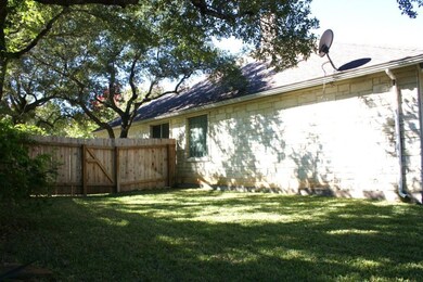 View of side of property with stone siding and a 