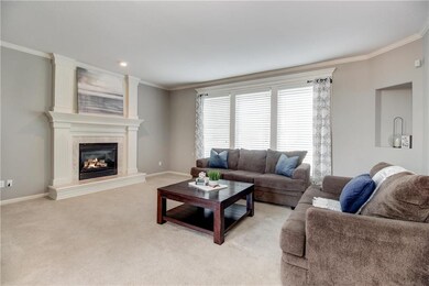 Light and bright living room with elegant fireplac