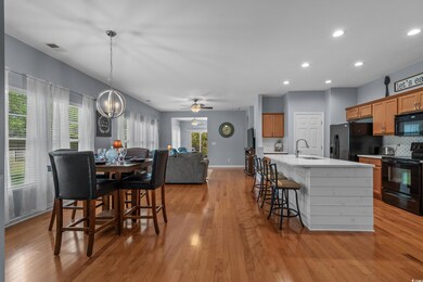 Dining room with recessed lighting, baseboards, vi