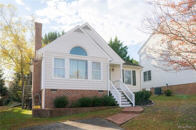 View of front of house with a front yard and centr