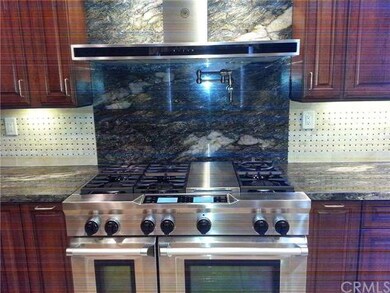 granite counters, tile backsplash and top of the l