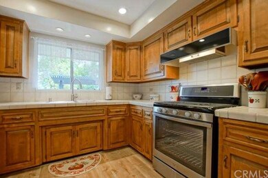 Kitchen Overlooks Serene Scene in Backyard