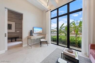 Home office with baseboards and beamed ceiling