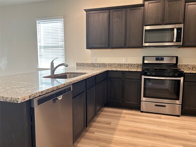 An open and dark stained cabinet is very modern