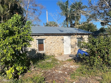 View of outbuilding with an outdoor structure