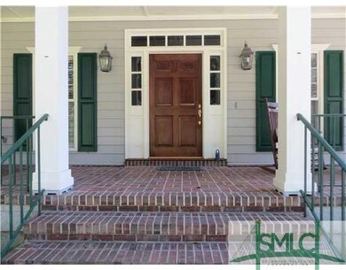 Porch. Grand front entrance with brick steps and a