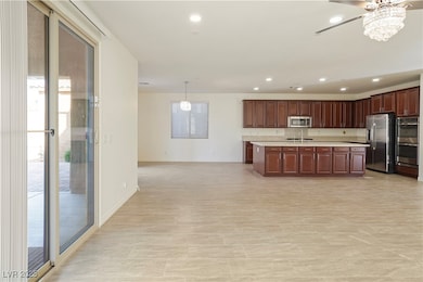 Kitchen featuring light countertops, recessed ligh