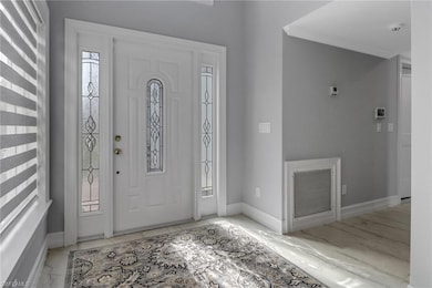 Entrance foyer featuring ornamental molding