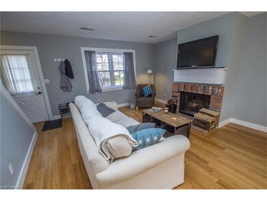 Living room with wood burning fireplace