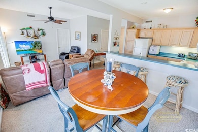 Dining room with ceiling fan and visible vents