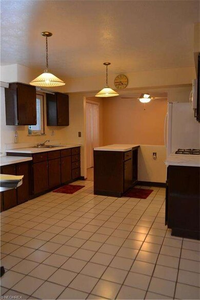 Seller has added a breakfast bar with space for ba