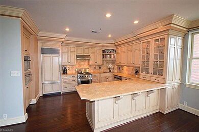 Stunning Gourmet Kitchen with Limestone Counters and Custom Cabinetry