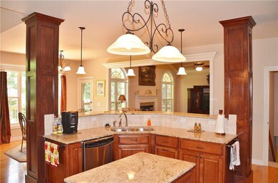 Kitchen open to informal dining area and 2 main floor living areas.
