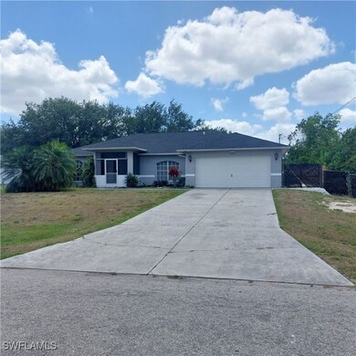 Ranch-style house with driveway, an attached garag
