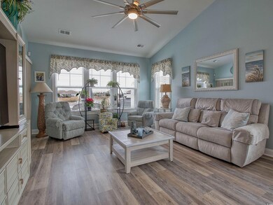 Living room with light wood-type flooring, ceiling