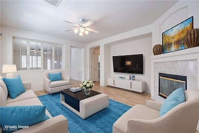 Virtually Staged Living area featuring a ceiling f